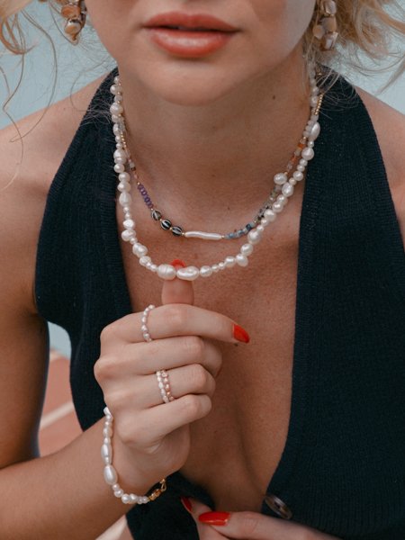 Mother of pearl and pearl collective necklaces