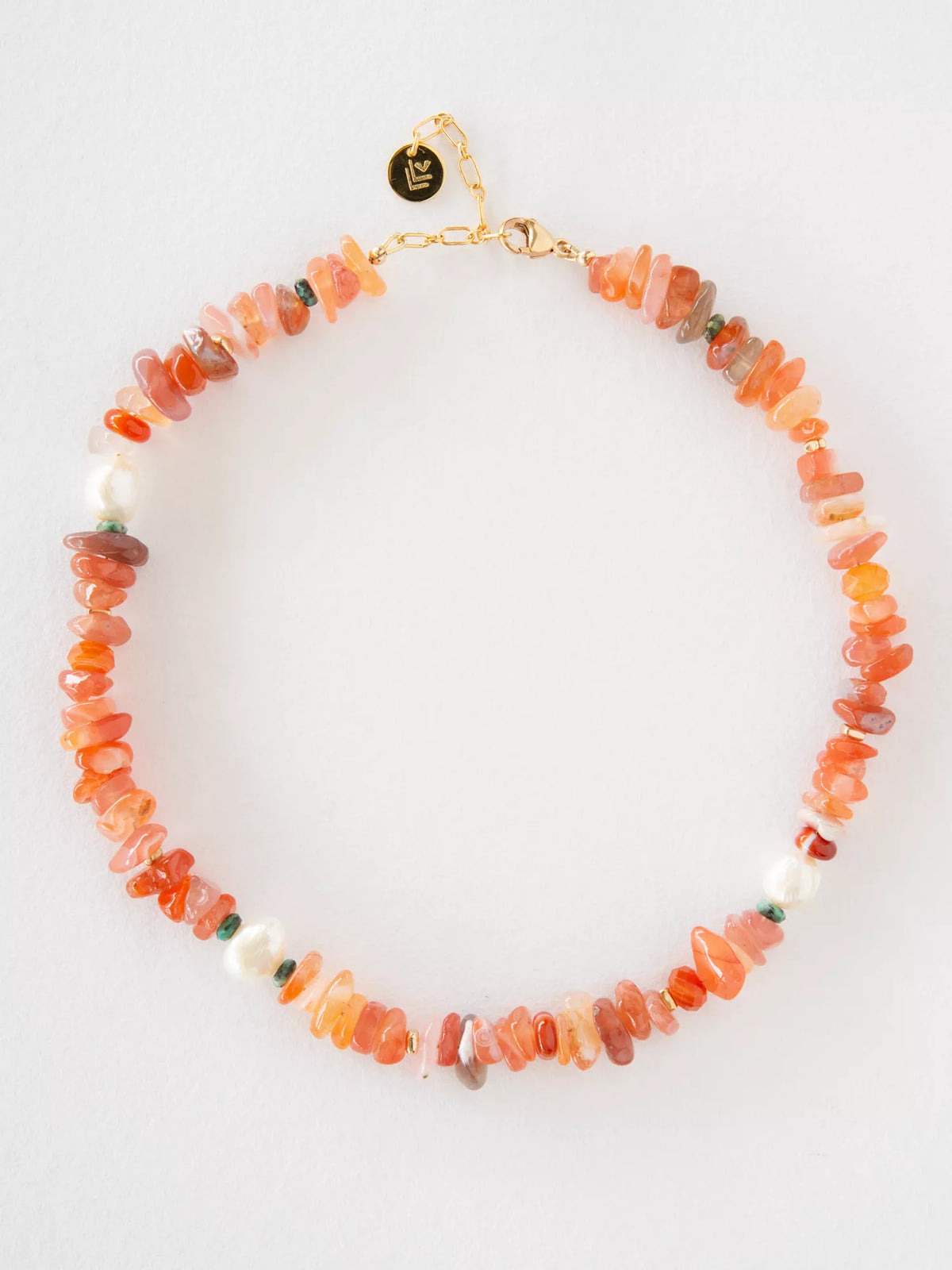 Necklace with orange and pink beads on a white background