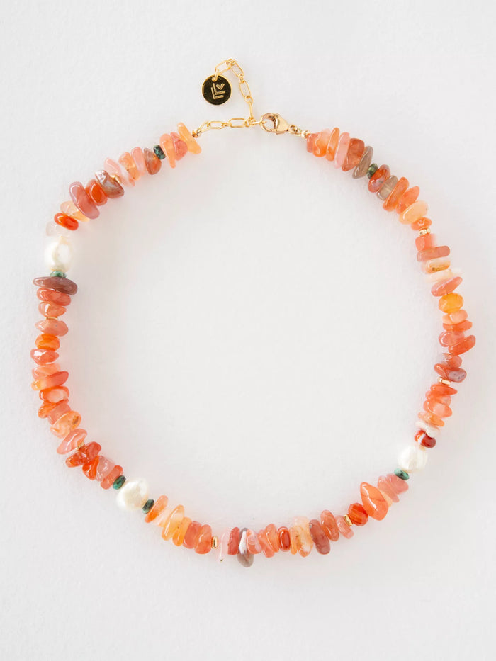 Necklace with orange and pink beads on a white background