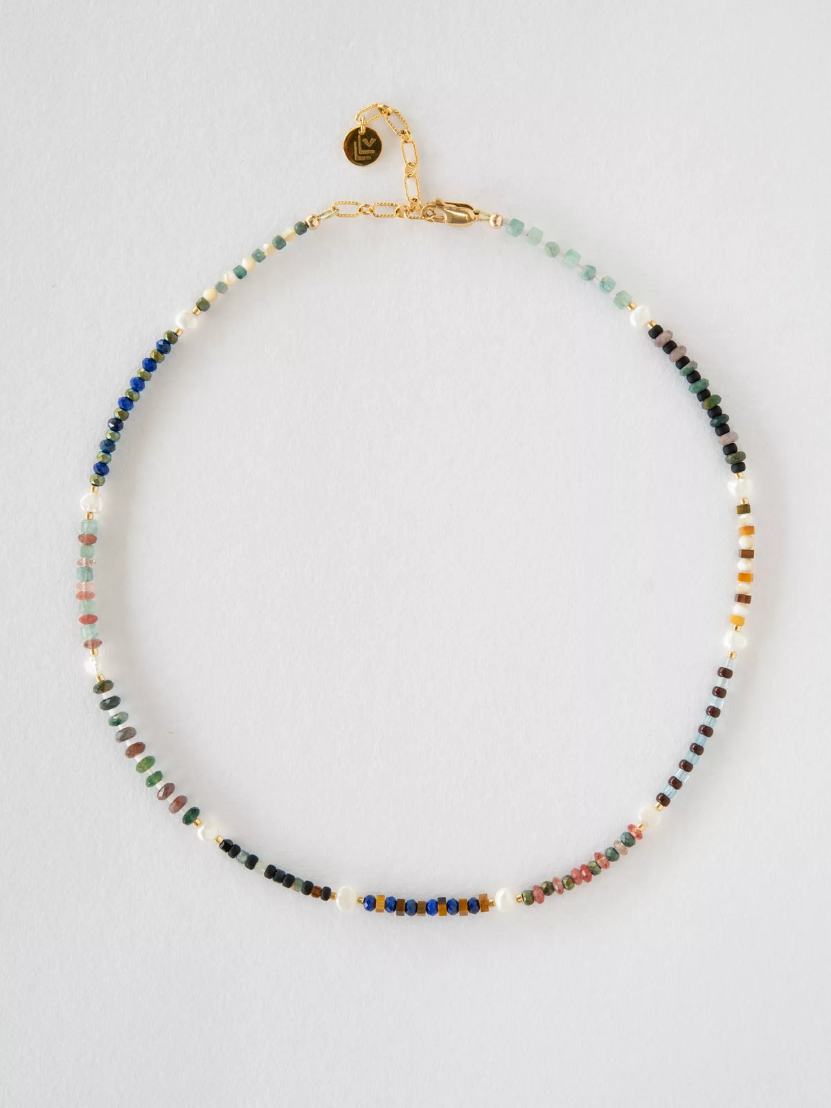 Multicolored beaded necklace on a light gray background