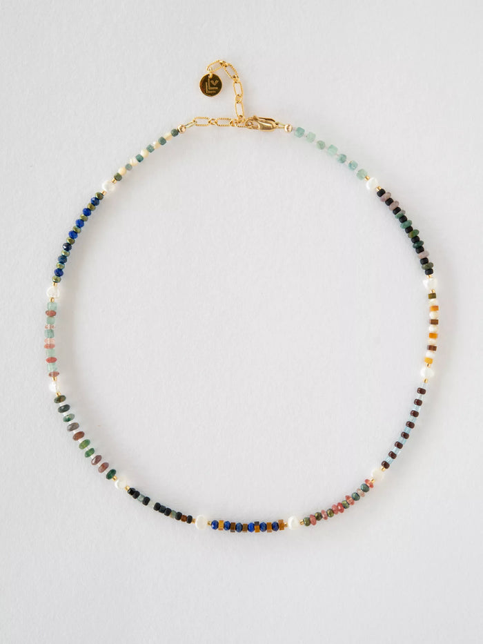 Multicolored beaded necklace on a light gray background