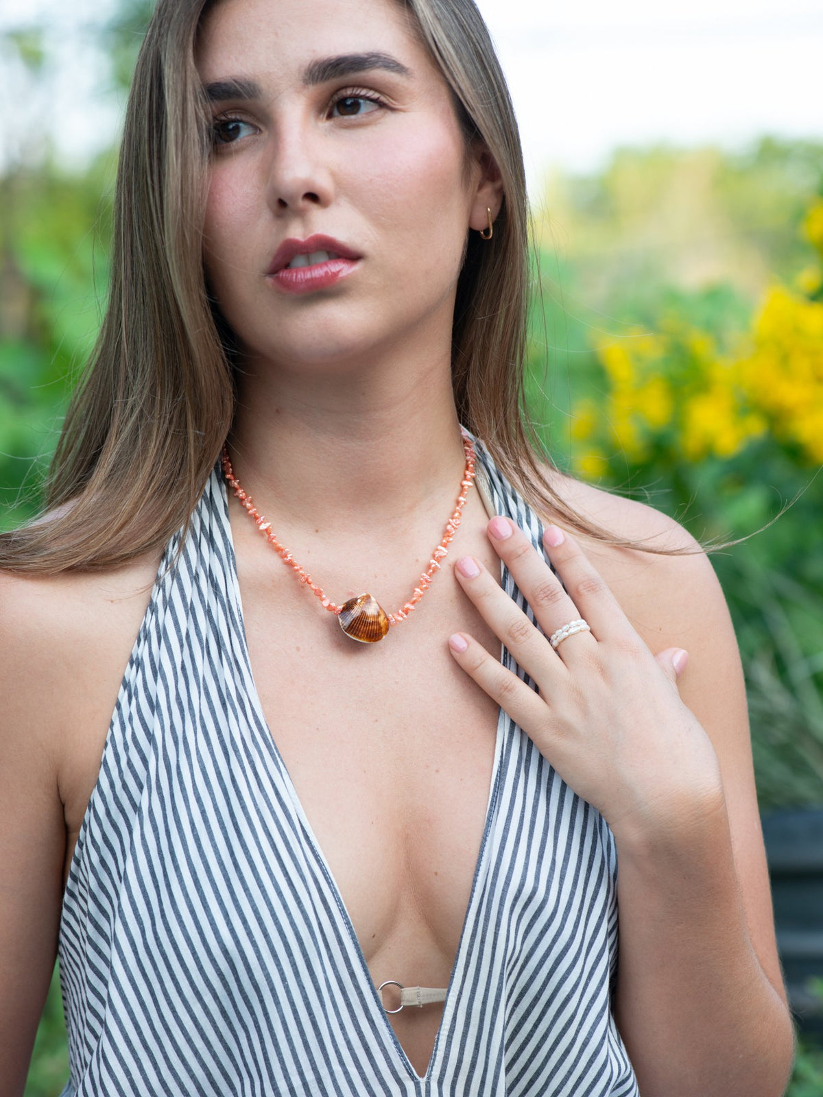 Beachcomber shell necklace on model