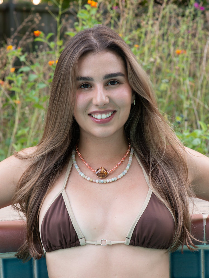 Beach comber shell necklace on model in pool