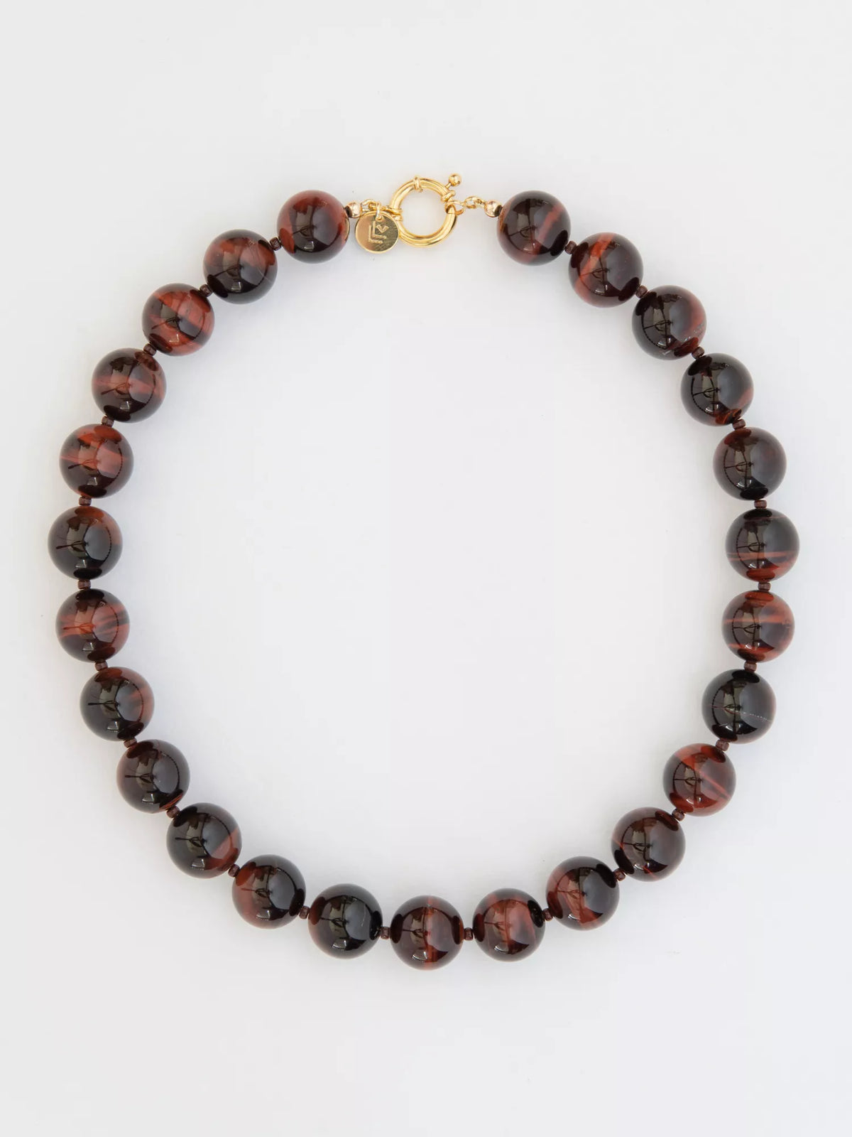 Necklace with red tiger's eye beaded design on a white background