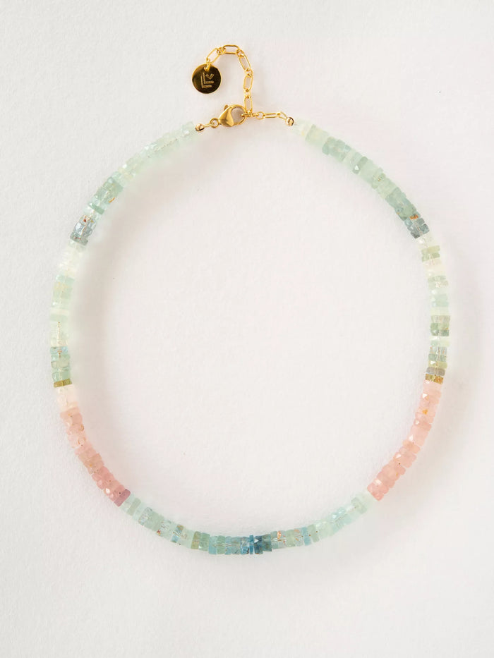 Necklace with multicolored beads on a white background