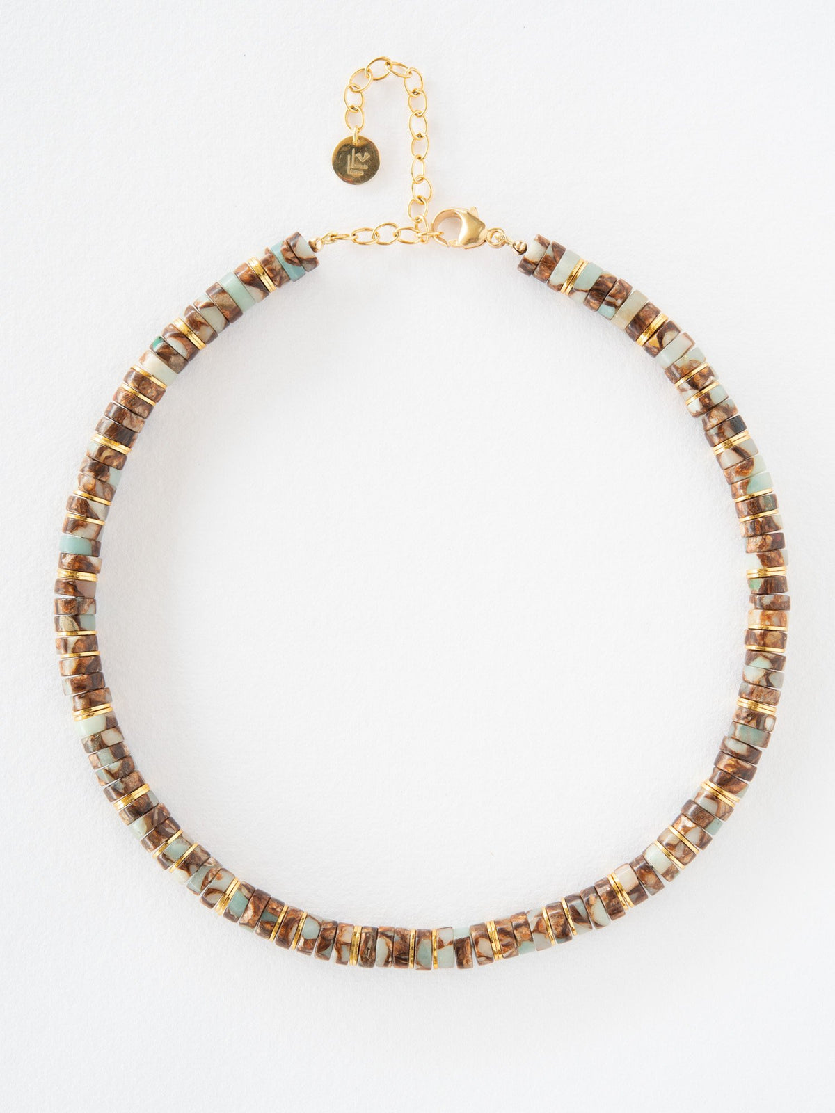 Necklace with brown and gold beads on a white background