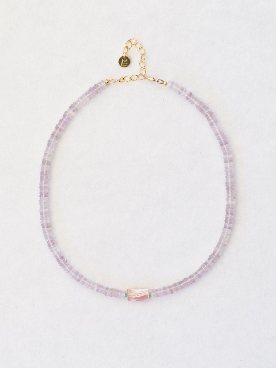 Beaded pink amethyst necklace on a white background.
