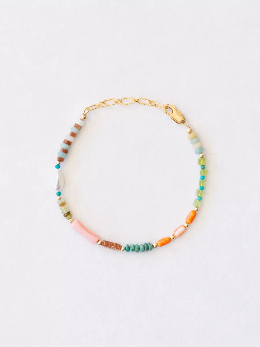 Multicolored beaded bracelet on a white background