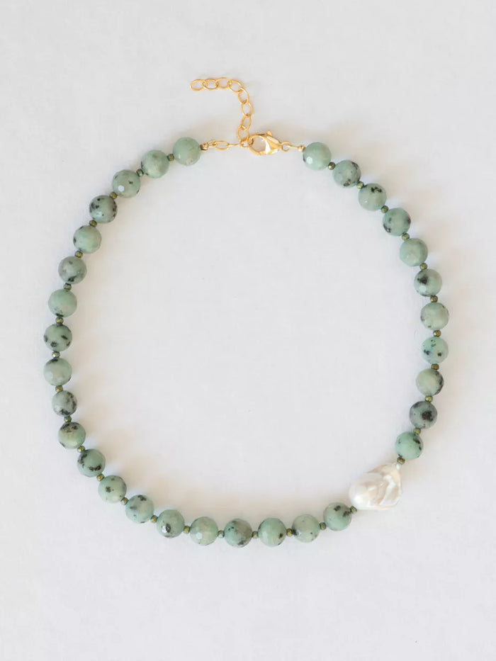 Seafoam Sesame Jasper Necklace with baroque pearl flat lay.
