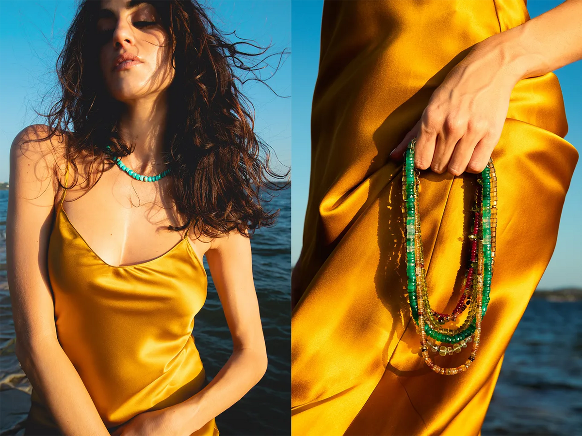 A split-screen lifestyle image showing a woman in a golden yellow satin slip dress wearing a turquoise beaded necklace, alongside a close-up of her hand holding a stack of colorful beaded necklaces against a sunny outdoor water background.