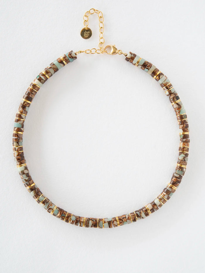 A gold-tone beaded necklace with alternating brown and light blue-green rectangular beads, displayed on a clean white background.