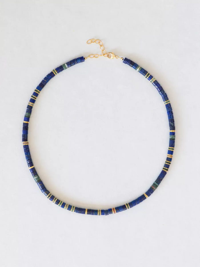 Blue and green beaded necklace with gold accents on a white background.