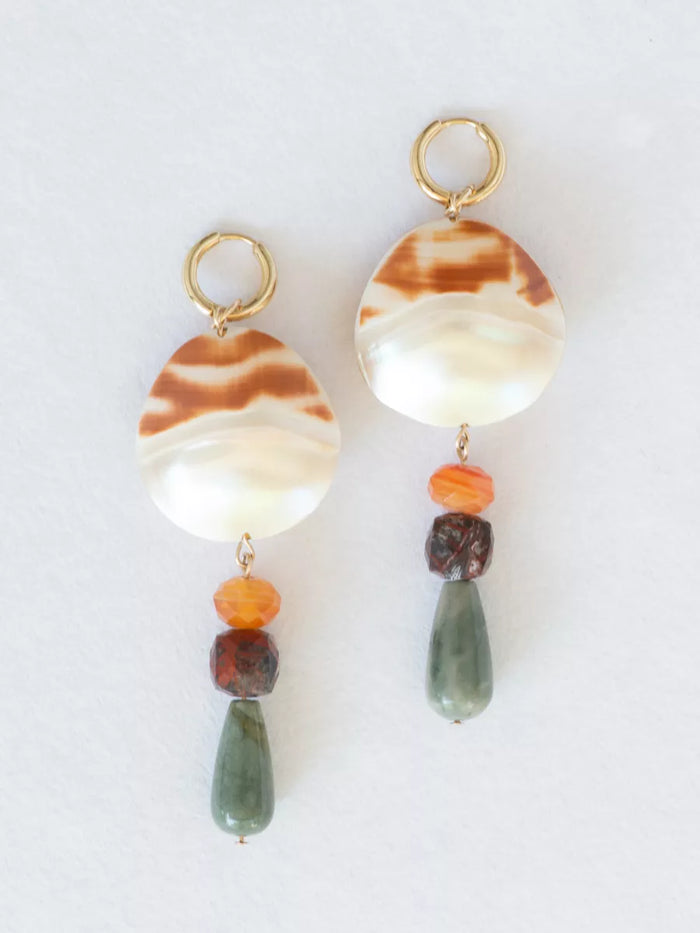 Pair of earrings with marbled stone and bead drops on a white background