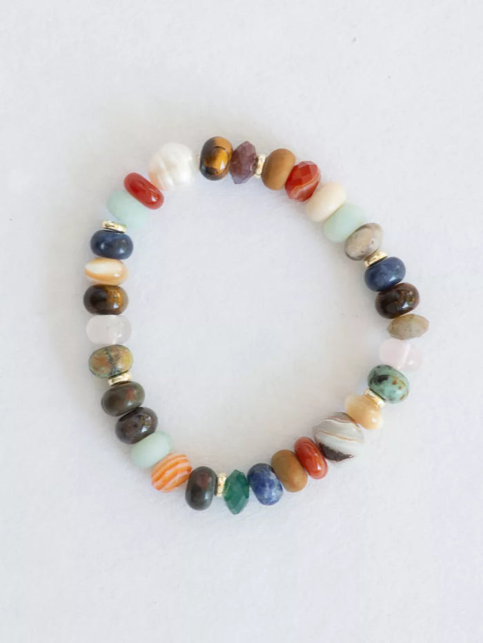 Multicolored stretch bracelet flat lay.