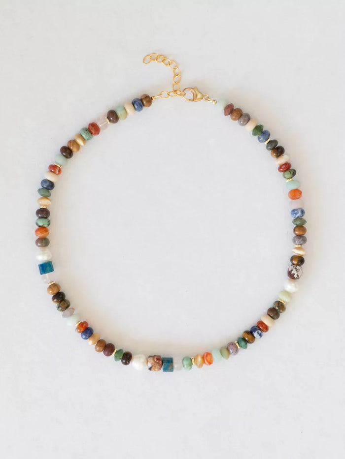 Multicolored beaded necklace on a white background