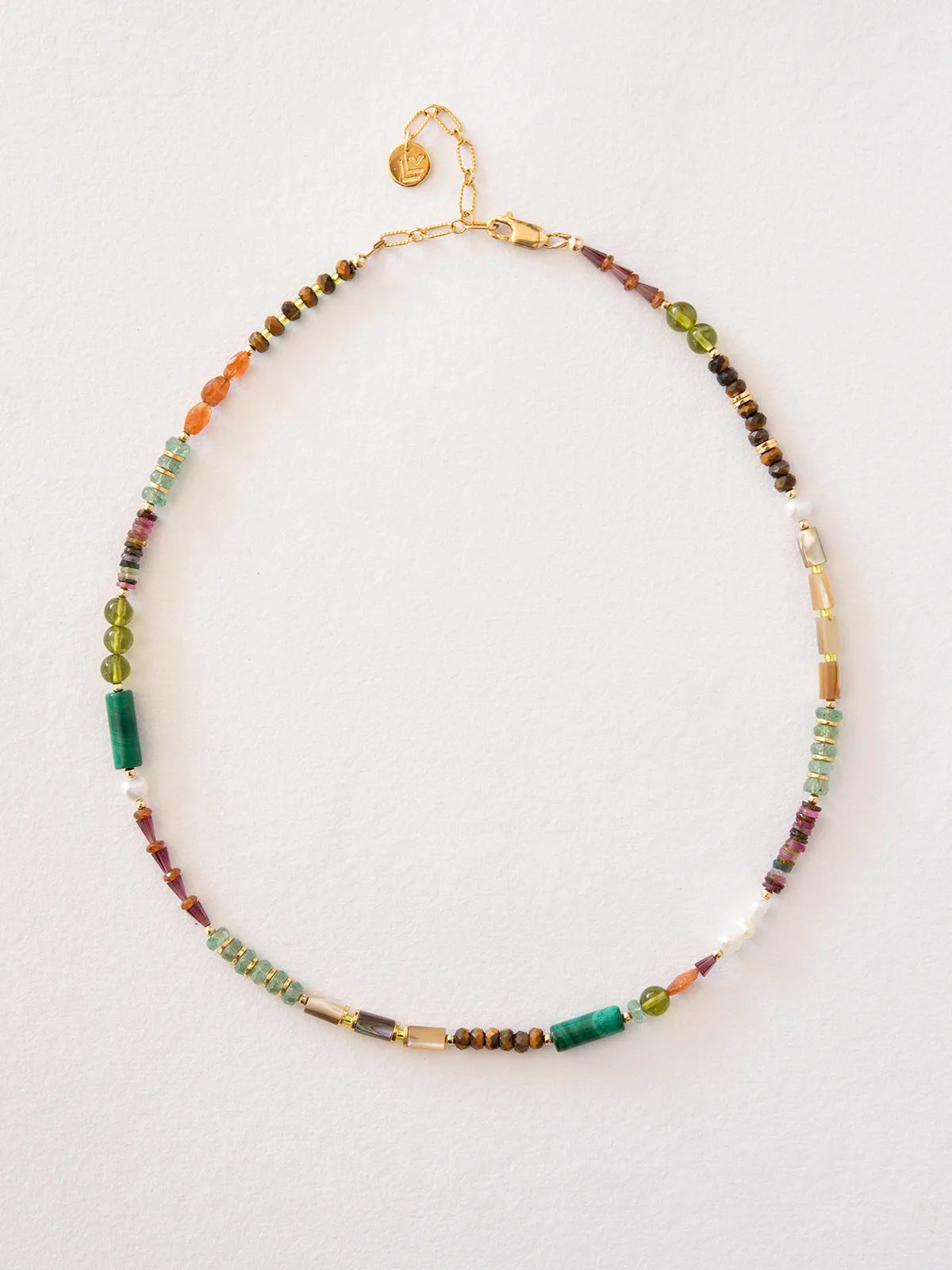 A beaded necklace with a gold chain and clasp, featuring a mix of colorful gemstone beads including green, brown, purple, orange, and white, displayed on a clean white background.