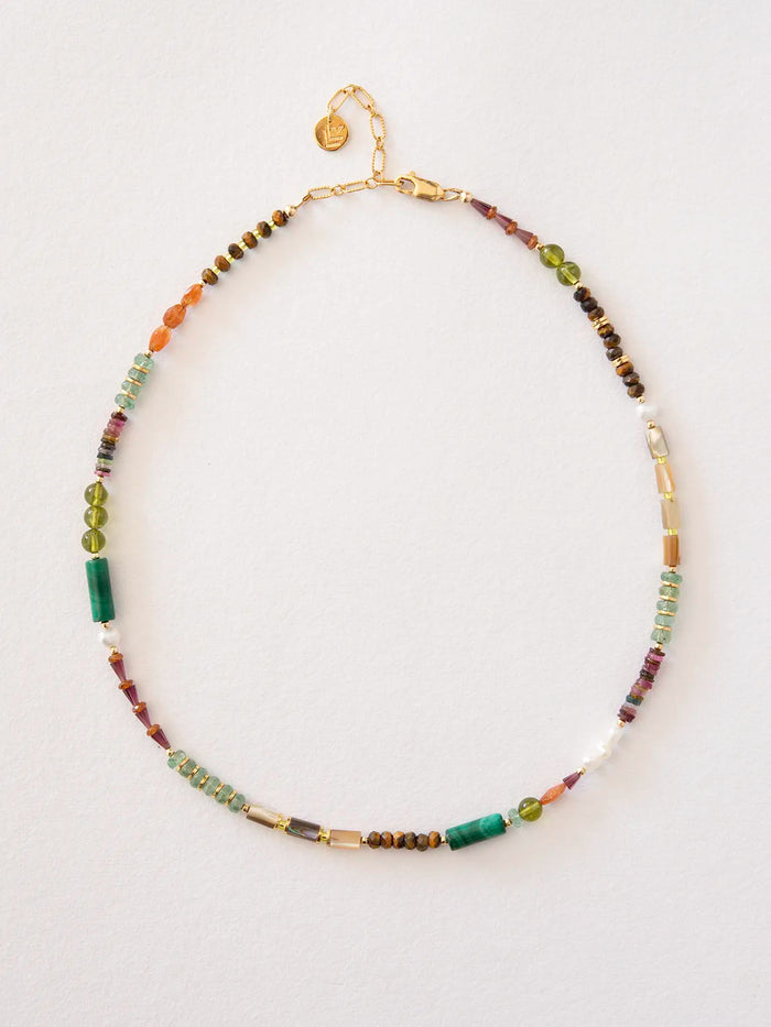 A beaded necklace with a gold chain and clasp, featuring a mix of colorful gemstone beads including green, brown, purple, orange, and white, displayed on a clean white background.