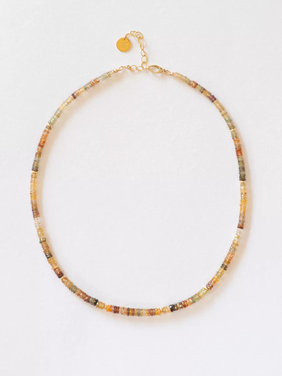 Multicolored beaded gem necklace on a white background