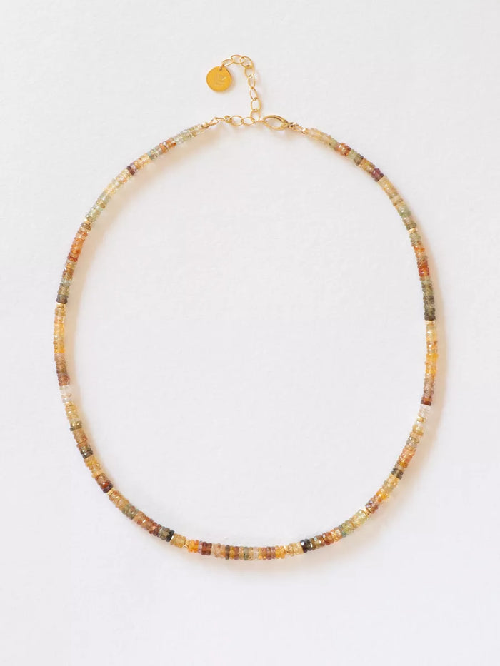 Multicolored beaded gem necklace on a white background