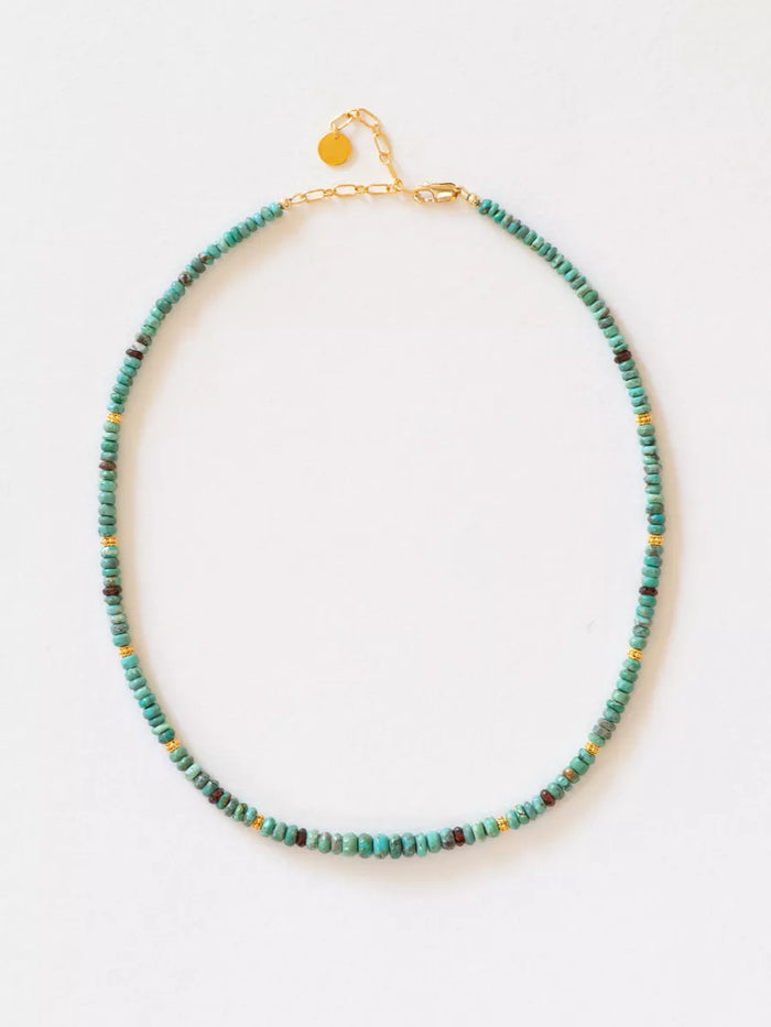 Necklace with turquoise beads on a white background