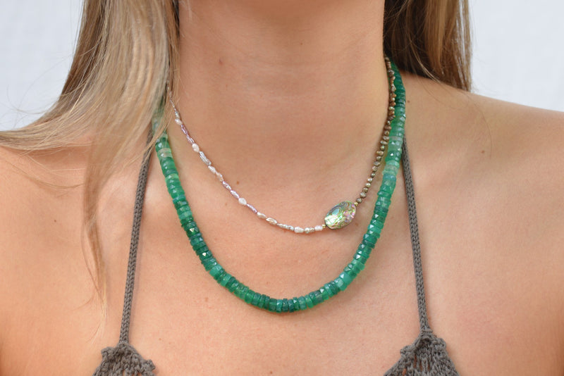 Close up of model wearing viridis gradient chacedony necklace